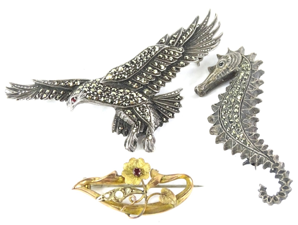 Three brooches, to include a silver and marquasite set eagle brooch, 7cm wide, a silver and