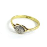 An 18ct gold and platinum dress ring, set with tiny diamonds, ring size O½, 2.2g all in.