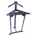 An unusual Compactom brand corner and gentleman's suit stand, on trestle type supports, 58cm W.