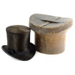 A Gentleman's top hat, stamped A W Wilkinson of Lincoln, in a leather case. (AF)