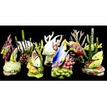 A collection of seven Royal Worcester porcelain models of exotic fish, each modelled by Ronald Van