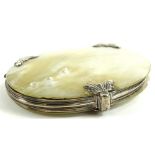 A 19thC mother of pearl cased magnifying glass, of oval form with white metal scroll mounts,