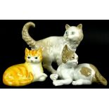 Three porcelain cats, to include Just Cats ginger tom, Nao cat and a Lladro cat (3).
