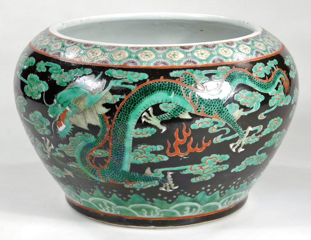 A Chinese Qing period porcelain jardiniere, the tapering circular body set with a four clawed dragon - Image 2 of 6