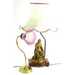 Two decorative table lamps, one example mounted with a spelter figure with a tapering shade, the