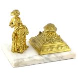 A late 19thC French marble inkstand, mounted with a gilt metal figure of a lady and a separate domed