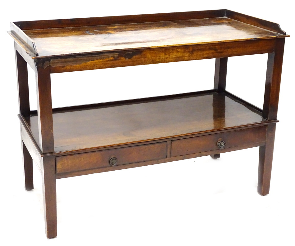 A 19thC mahogany washstand, the rectangular top with a raised gallery above an under tier with two