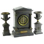 A late 19thC French black slate and metal marble clock, the clock itself modelled in the form of a