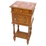 A French oak pot cupboard, the rectangular top with a rouge marble inset above a frieze drawer and a