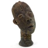 Tribal Art. A terracotta bust of a man with oval shaped head, tapering neck (AF), 18cm H.