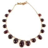 A 9ct gold Victorian style necklace, with mixed cut garnet stones, including oval, circular and tear