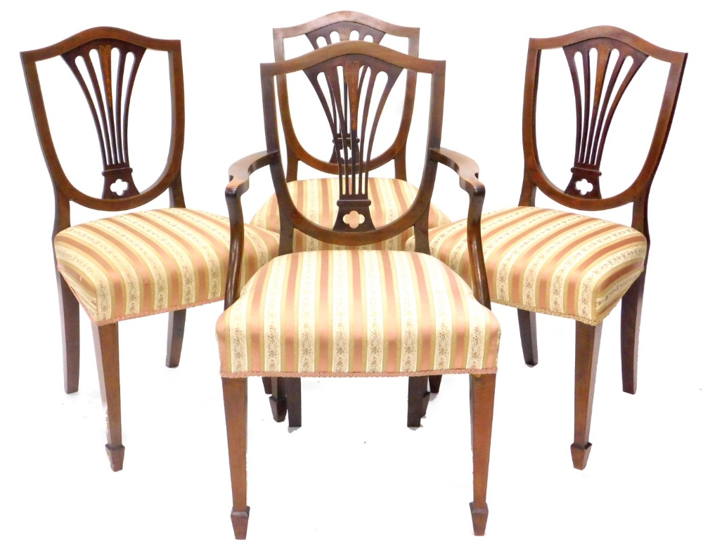 A set of four Edwardian mahogany chequer banded and boxwood strung dining chairs, each with a