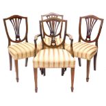 A set of four Edwardian mahogany chequer banded and boxwood strung dining chairs, each with a