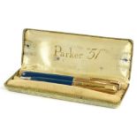 A green and gold coloured Parker 51 fountain pen, and matching propelling pencil in original box.