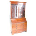 An Edwardian mahogany and rosewood cross banded bureau bookcase, the top with a moulded cornice with