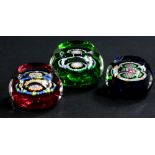 Three similar small Whitefriars millefiori paperweights, in green, pink and blue, the largest 4cm