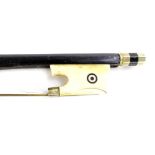 A continental ebonised violin bow, with carved ivory frog (AF), 70cm L.