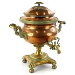 An early Victorian copper and brass two handled tea urn or samovar, with a pattera shaped handle, an