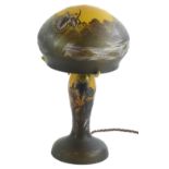 An etched glass table lamp and shade, decorated with flowers, dragonfly etc., bearing the name