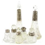 A collection of cut glass and silver mounted scent bottles, to include scent bottles and stoppers