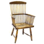 A late 18th/early 19thC ash and elm country made stick back chair, with spindle turned back,