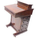 An Edwardian style mahogany and tulipwood cross banded Davenport, the top with a hinged lid