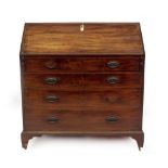 A George III mahogany bureau, with fall flap resting on lopers, revealing fitted interior of