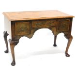 A burr walnut and walnut lowboy in mid 18thC style, the rectangular quarter veneered top with a