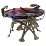 A late 19th/early 20thC Art Nouveau iridescent purple glass bowl, with bronze mounts, cast with