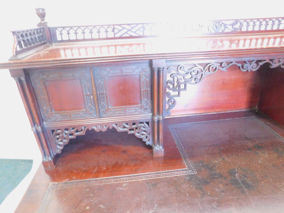 A late 19th/ early 20thC Edwards and Roberts writing table, in Chippendale style, the raised back - Image 3 of 3