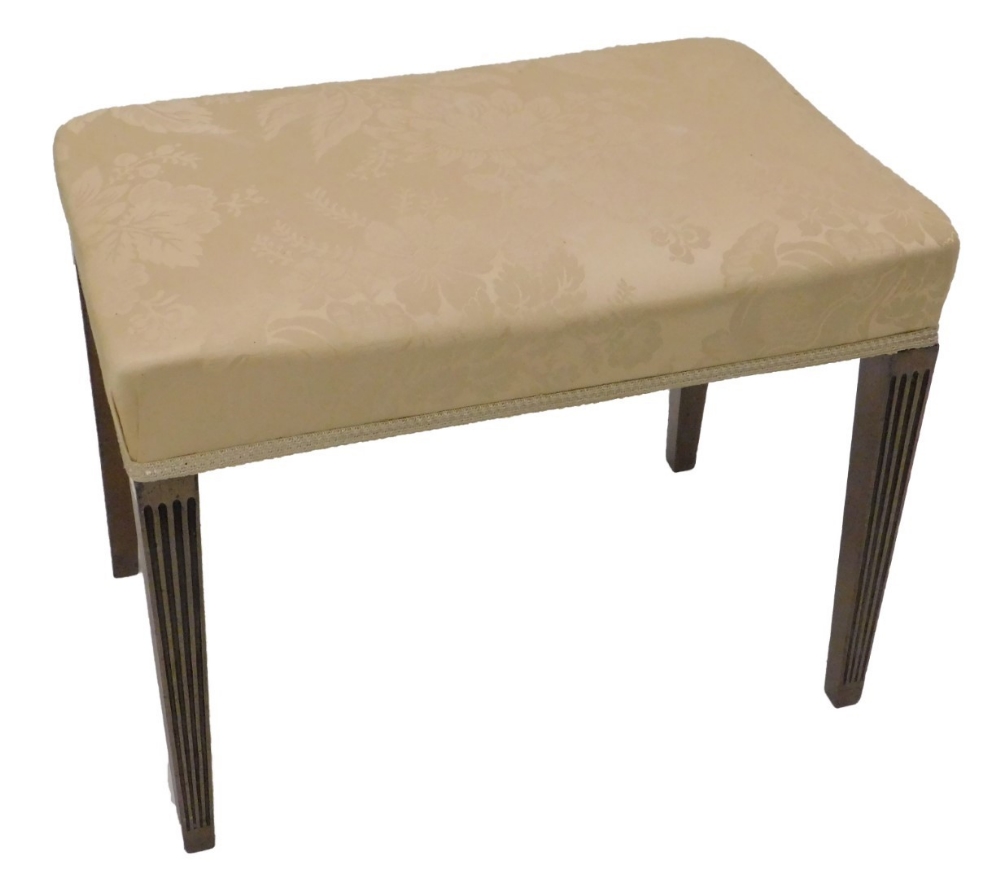 A George III mahogany stool, the rectangular padded top upholstered in beige damask type material,