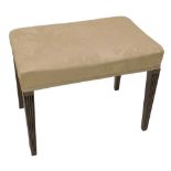 A George III mahogany stool, the rectangular padded top upholstered in beige damask type material,