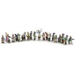 A collection of Volkstedt porcelain monkey band figures, in the Meissen style with various