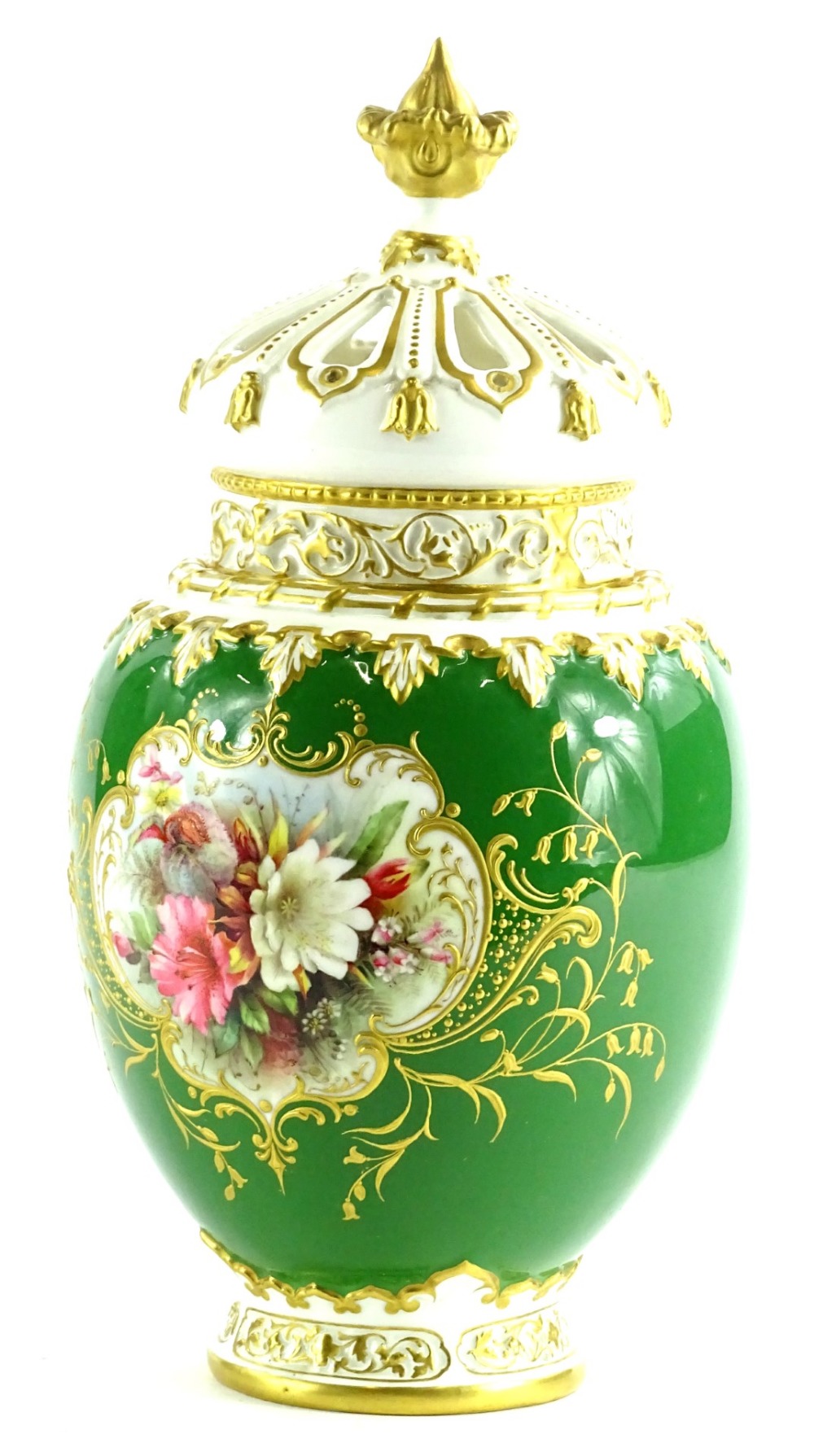 A Royal Worcester porcelain pot pourri jar cover, painted with a flower spray, on a green ground