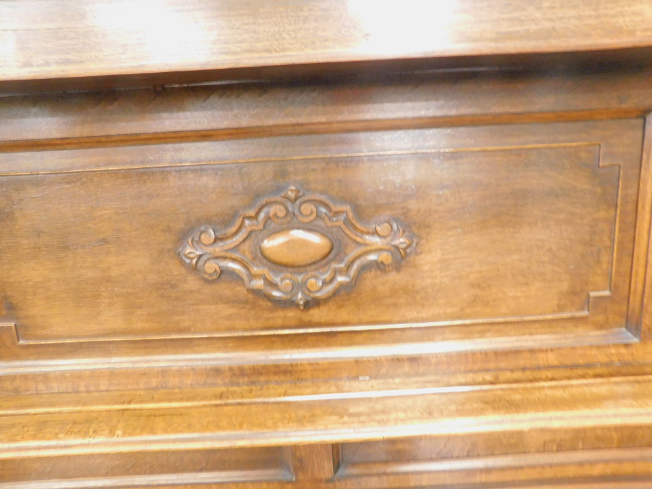 A 20thC oak sideboard, the raised back with a moulded and gadrooned cornice, above a panel front - Image 2 of 2