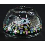 A Whitefriars lead crystal paperweight, decorated with a collection of Millefiori canes in star type