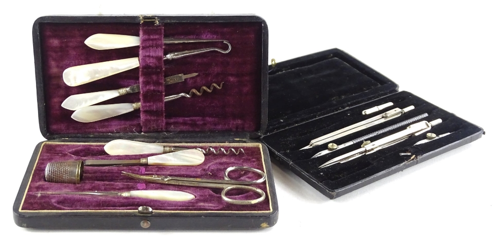 A mother of pearl and plated metal ladies neccessaire, in a fitted case and a set of drawing