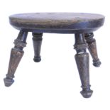 A 19thC elm and ash turned wooden small stool, 23cm W.