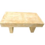 A modern limed wooden coffee table, on end supports, 120cm W.
