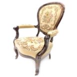 A 19thC mahogany show frame armchair, with a wool work padded back, armrest and seat, on cabriole