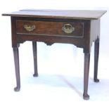 A late 18thC oak lowboy, the rectangular top with a frieze drawer on turned tapering legs with pad