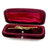 A 9ct gold bar brooch, with twist design set with seed pearls, 5cm W, boxed, 1.7g all in.