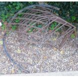 A pair of wrought iron corner hay racks of angular form, and another hay rack (3).