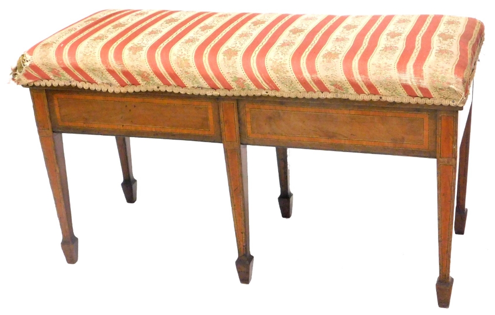 An Edwardian mahogany satinwood cross banded duet stool, with a hinged padded seat on square