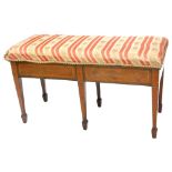 An Edwardian mahogany satinwood cross banded duet stool, with a hinged padded seat on square