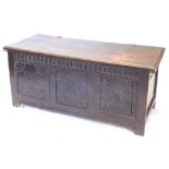 A late 17th/early 18thC oak coffer, the associated rectangular top with a carved border, above a