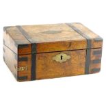 A Victorian walnut and brass bound writing box, the hinged lid enclosing a maroon and gilt tooled