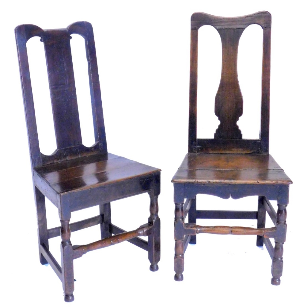 Two 17thC oak side chairs or back stools, each with a solid splat and seat, on part turned legs with