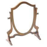 A small mahogany shield shaped dressing table mirror, on shaped supports, 32cm W.