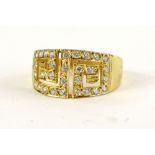 A Greek design dress ring, set with tiny diamonds, on a yellow metal band, marked 585, ring size